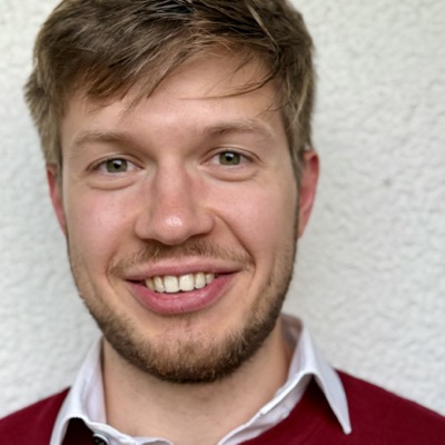 Portrait of Andrei Arkhipov, software engineer and co-founder of Hut Finder